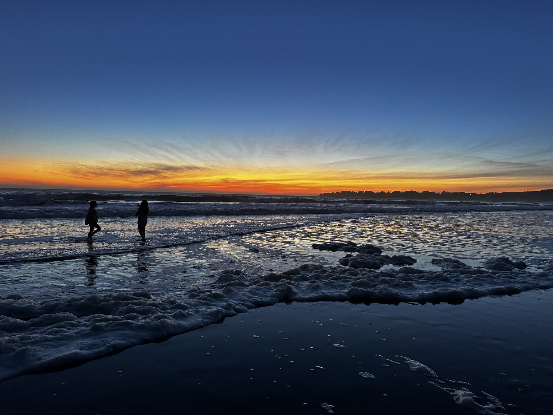 a small group silhouetted against the dusk sky