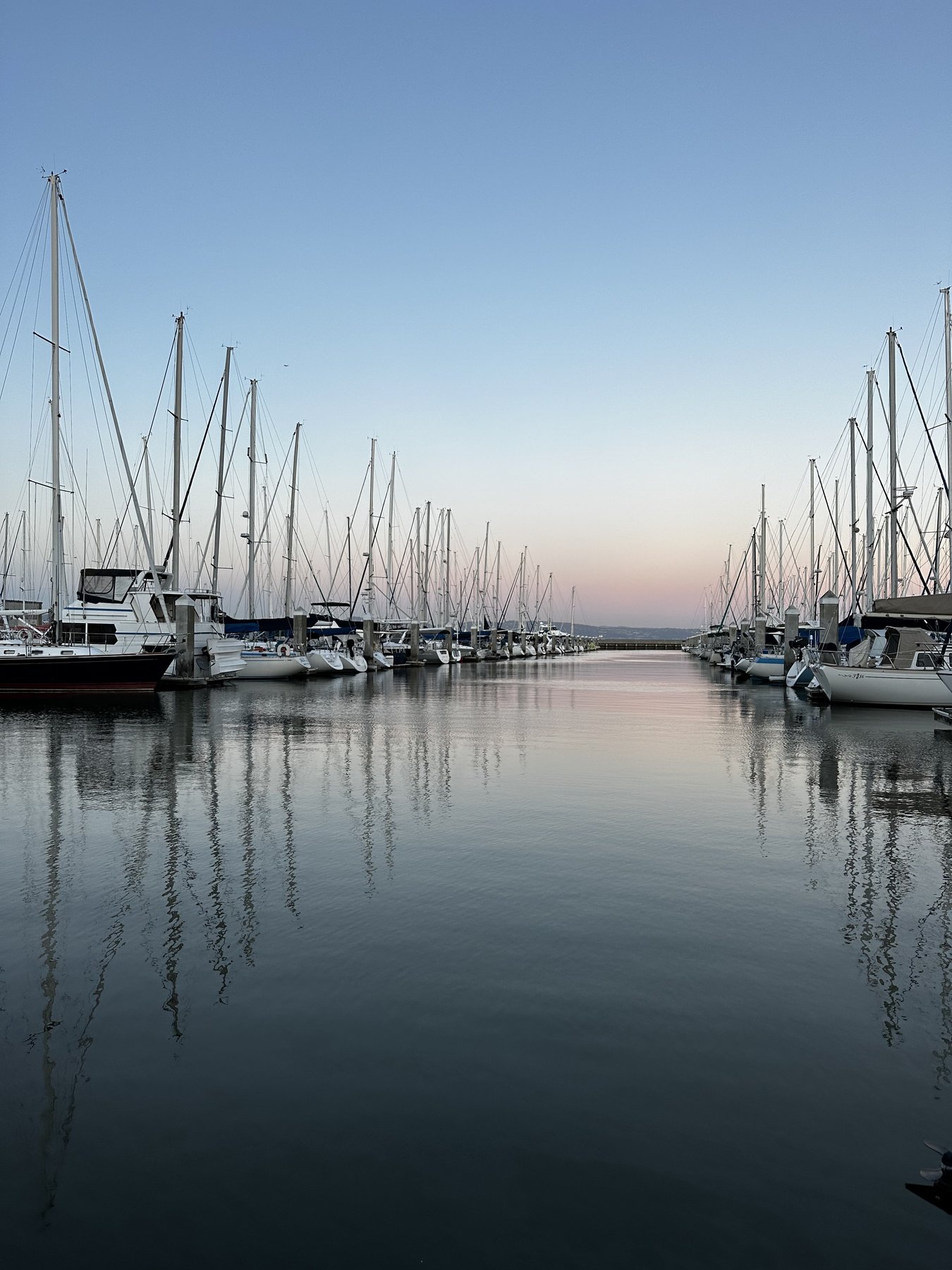 marina at twilight with a boat in the foreground
