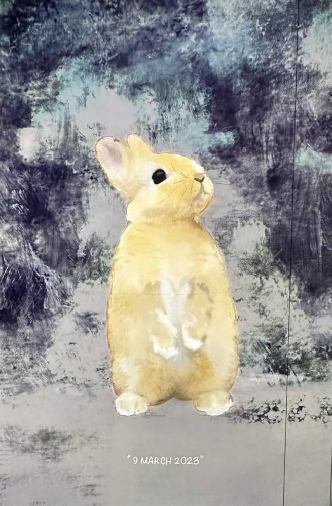 the same rabbit portrait against a moody textured blue-gray background