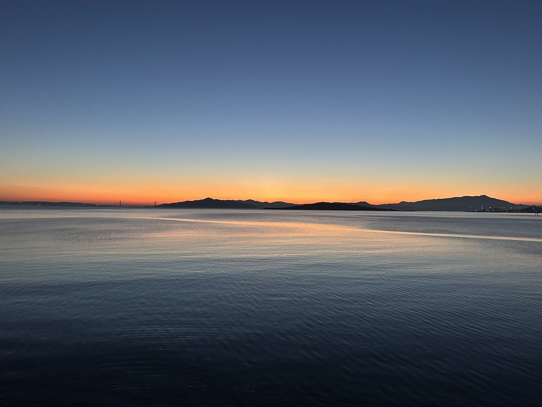 a calm horizon line, soft blue to orange gradient